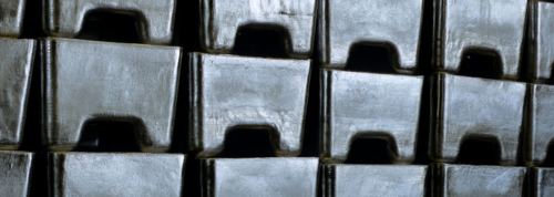 Stacked zinc ingots in a warehouse.
